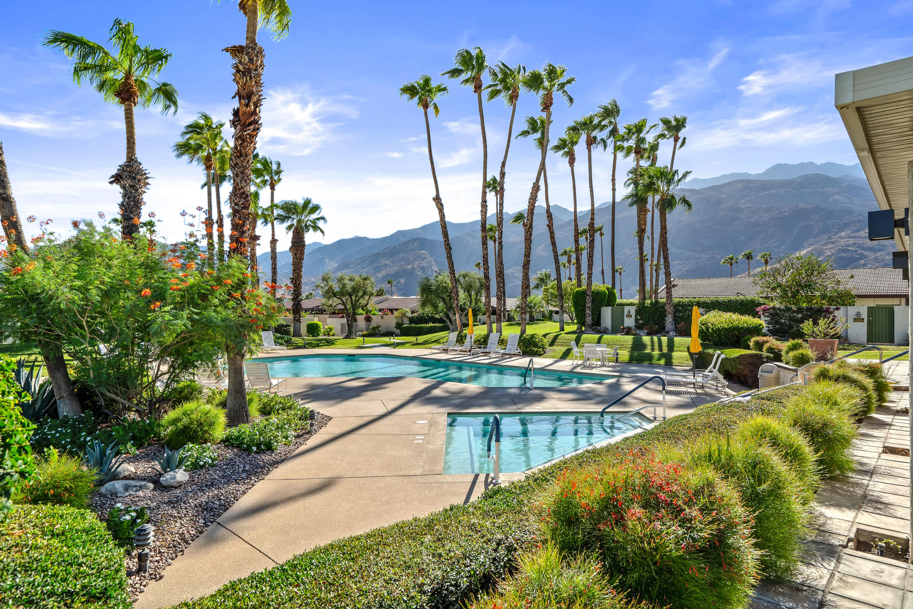 1384 East Andreas Road Palm Springs, CA 92262 - Photo 38 of 46 a view of swimming pool with outdoor seating and green space