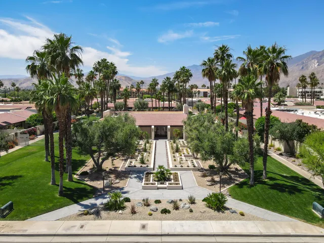 a view of a water fountain in front of the house