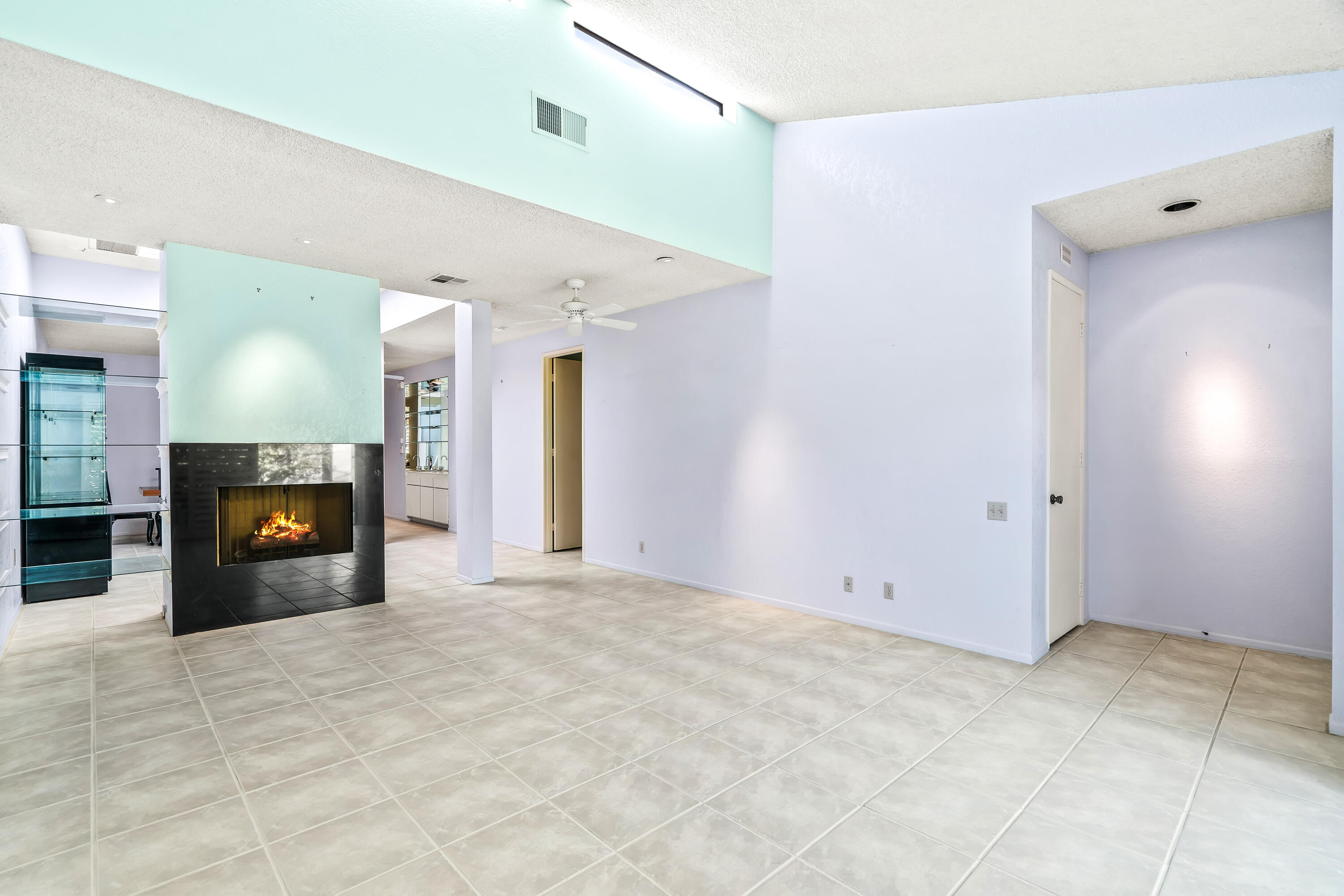 1384 East Andreas Road Palm Springs, CA 92262 - Photo 9 of 46 a view of an empty room with a fireplace