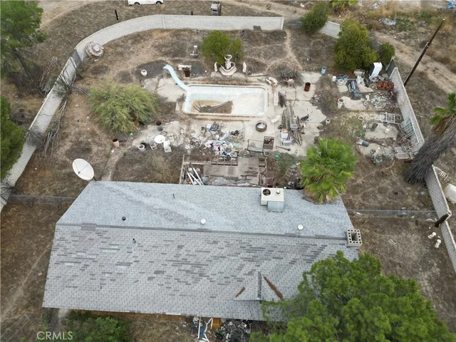 an aerial view of a residential houses with outdoor space