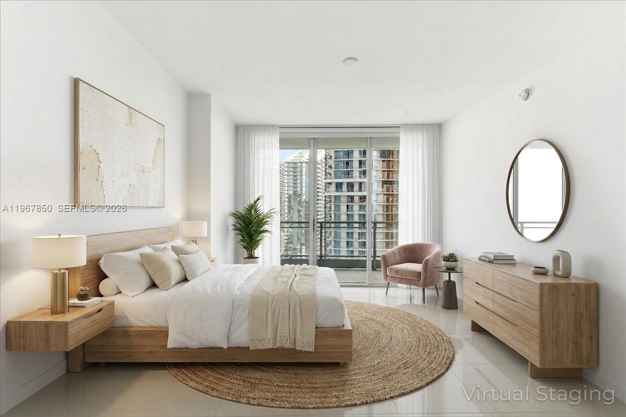 92 Southwest 3rd Street, Unit 3804 Miami, FL 33130 - Photo 12 of 36 a living room with furniture and a large window
