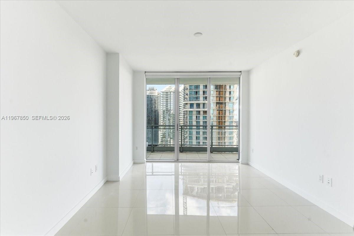 92 Southwest 3rd Street, Unit 3804 Miami, FL 33130 - Photo 13 of 36 a view of an empty room with a window