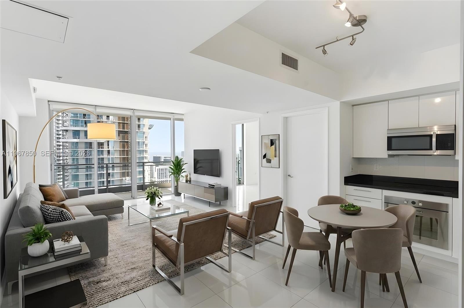 92 Southwest 3rd Street, Unit 3804 Miami, FL 33130 - Photo 3 of 36 a living room with furniture and a flat screen tv