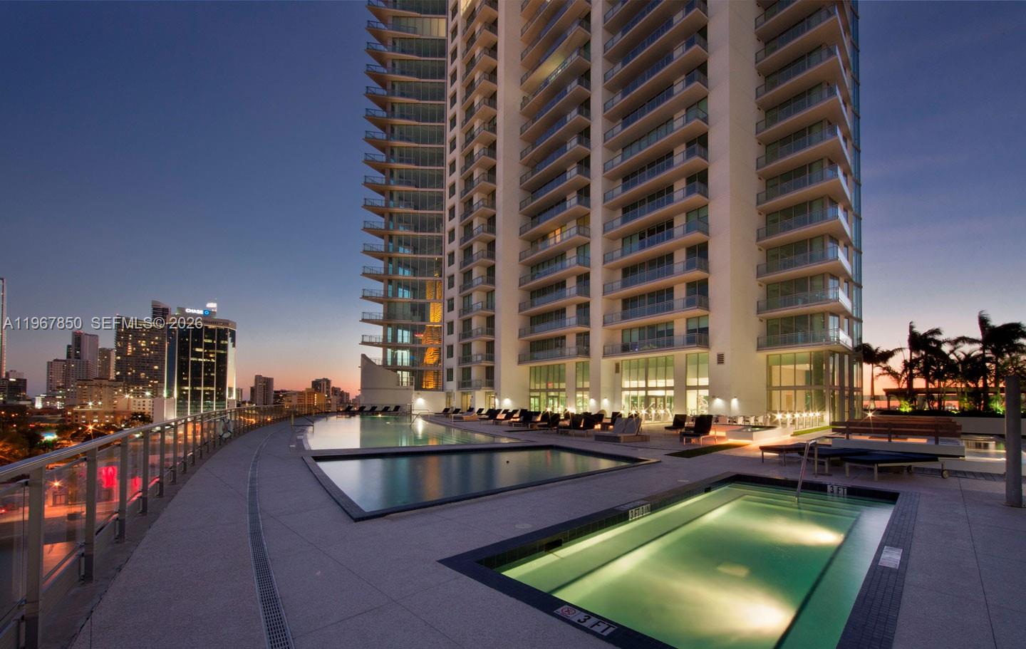 92 Southwest 3rd Street, Unit 3804 Miami, FL 33130 - Photo 34 of 36 a view of swimming pool with outdoor seating