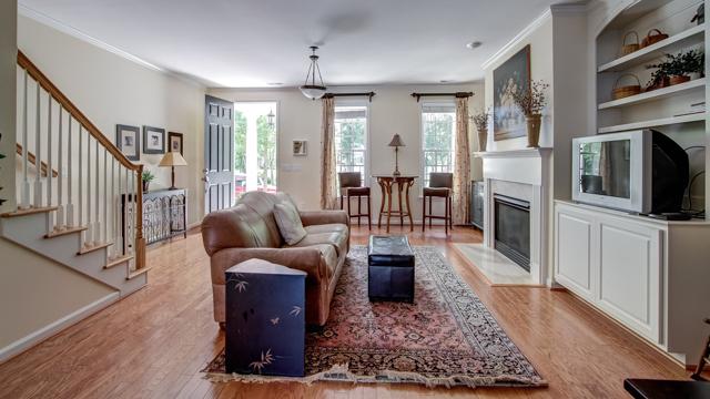 92 Pearl Street Franklin, TN 37064 - Photo 6 of 20 Watch your favorite TV show (HOA fee includes cable TV) with new-found friends in this well-designed family room with built-ins and hardwood floors. Or mosey on down to the 37 seat theater for a free movie and popcorn.