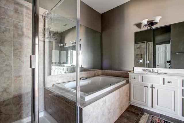 92 Pearl Street Franklin, TN 37064 - Photo 9 of 20 The master bath has double vanities, large shower, tile floor, and jetted tub. The entire home is immaculate