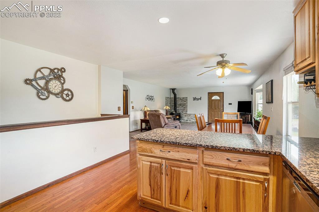 4810 Airport Road Colorado Springs, CO 80916 - Photo 12 of 41 a view of living room with granite countertop furniture and a fireplace