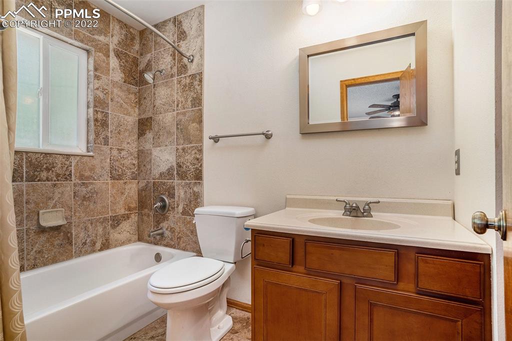 4810 Airport Road Colorado Springs, CO 80916 - Photo 15 of 41 a bathroom with a sink toilet and bathtub