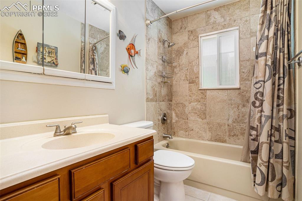 4810 Airport Road Colorado Springs, CO 80916 - Photo 16 of 41 a bathroom with a sink toilet and shower
