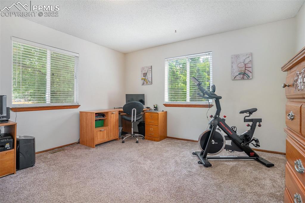 4810 Airport Road Colorado Springs, CO 80916 - Photo 17 of 41 a view of a workspace with furniture and a window