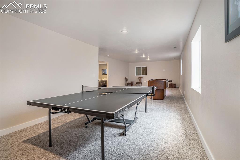4810 Airport Road Colorado Springs, CO 80916 - Photo 22 of 41 a room with furniture pool table and a window