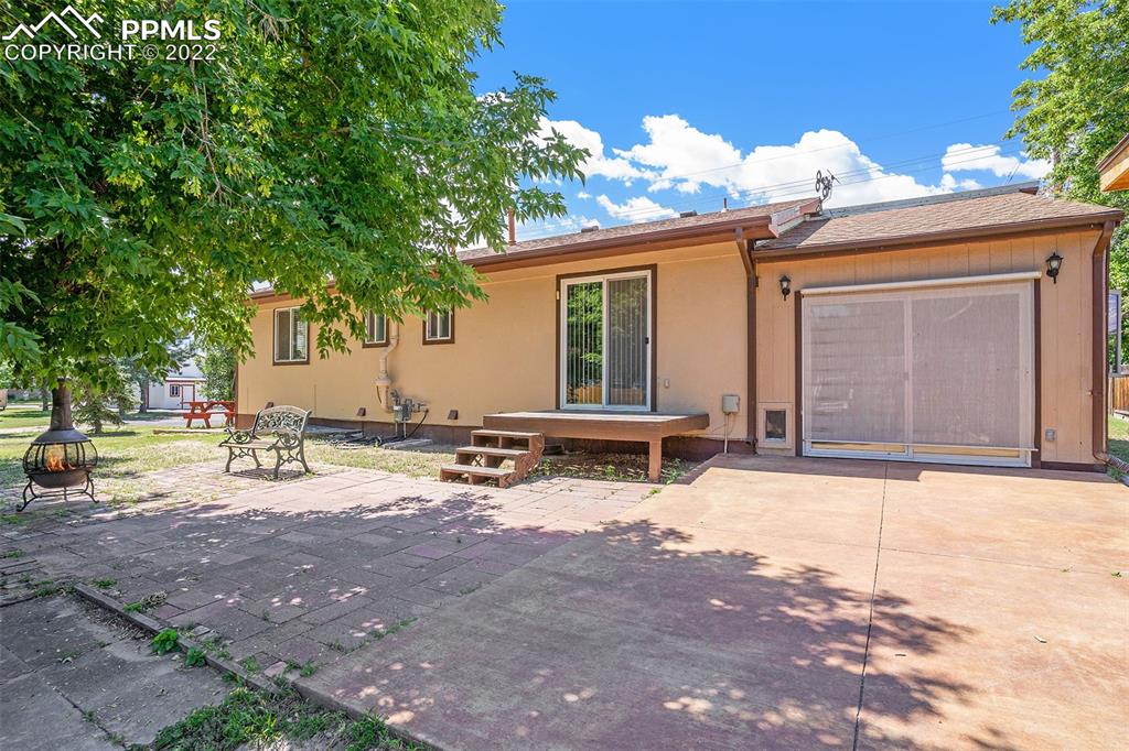 4810 Airport Road Colorado Springs, CO 80916 - Photo 28 of 41 a view of a house with backyard and sitting area