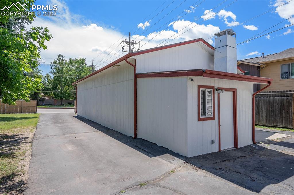 4810 Airport Road Colorado Springs, CO 80916 - Photo 34 of 41 a view of a house with a yard