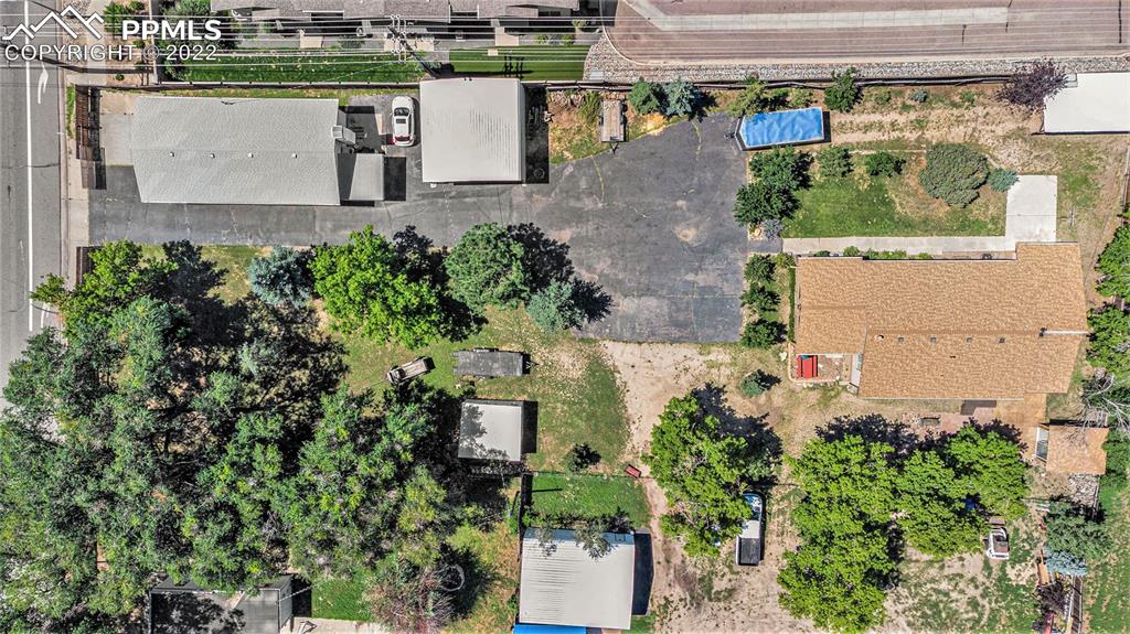 4810 Airport Road Colorado Springs, CO 80916 - Photo 39 of 41 an aerial view of a house with a yard