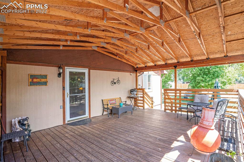 4810 Airport Road Colorado Springs, CO 80916 - Photo 4 of 41 a dining room with furniture wooden floor and windows