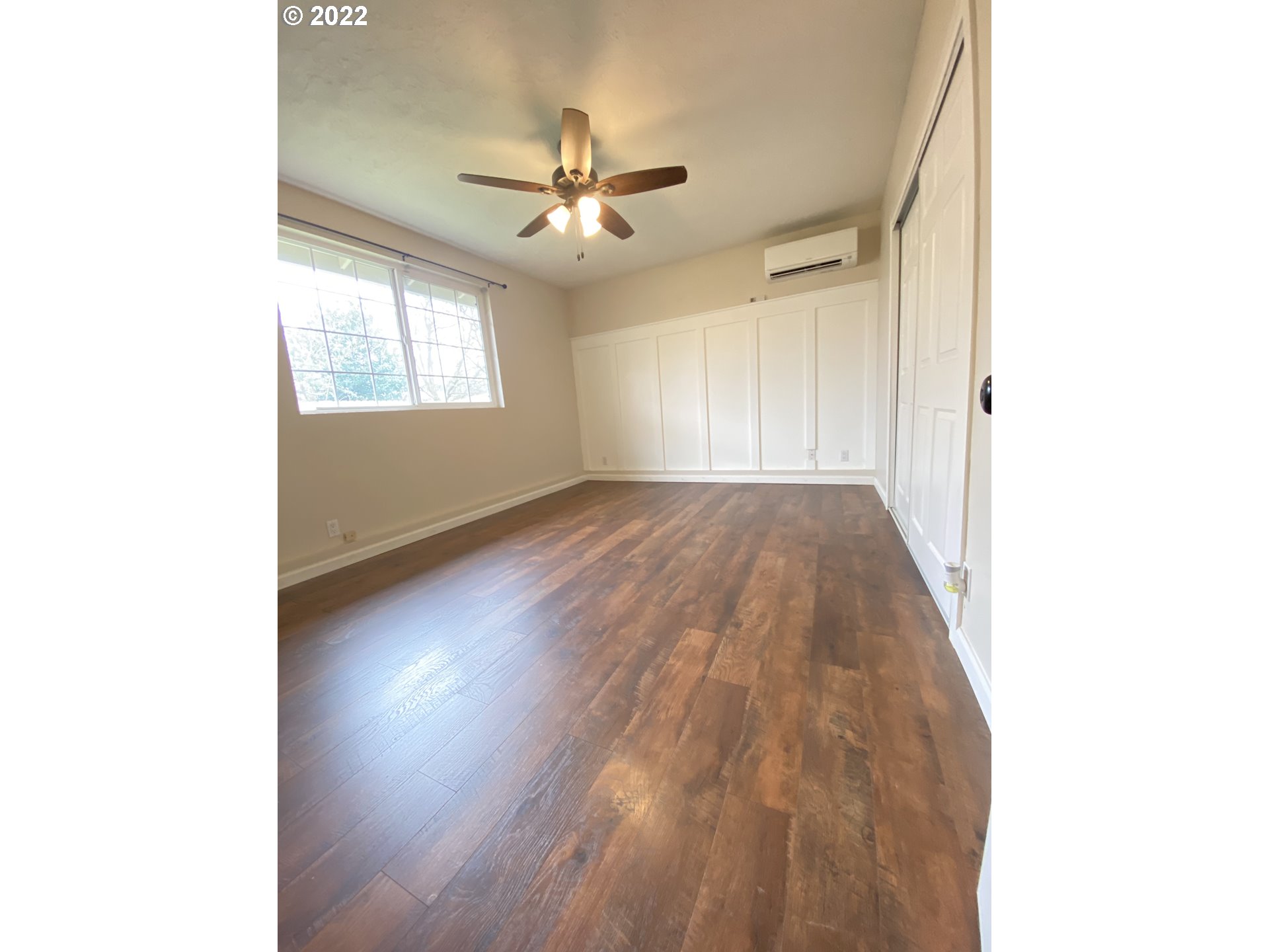 5330 B Street Springfield, OR 97478 - Photo 17 of 28 a view of an empty room with wooden floor and a window