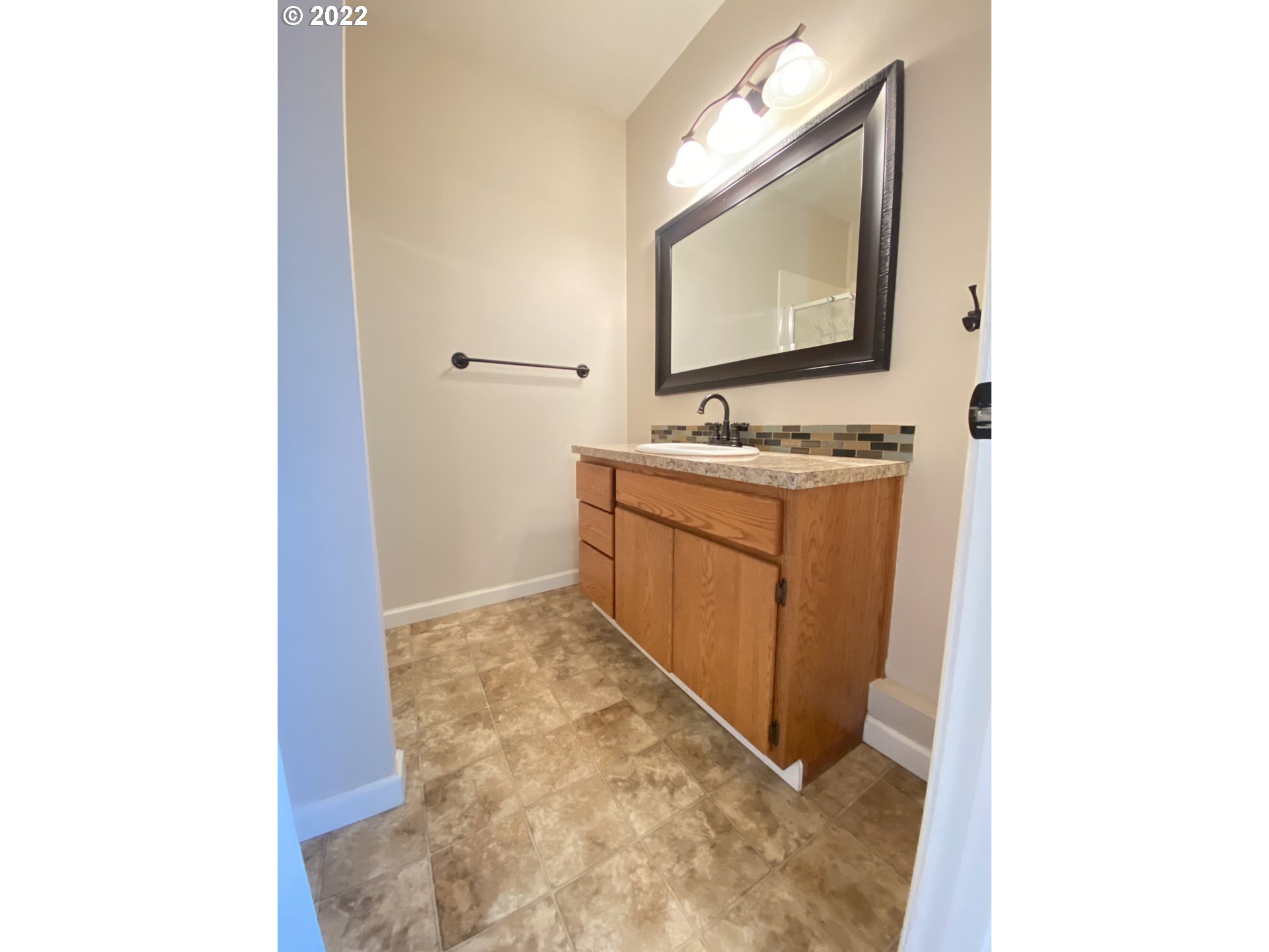 5330 B Street Springfield, OR 97478 - Photo 19 of 28 a bathroom with a sink and a mirror