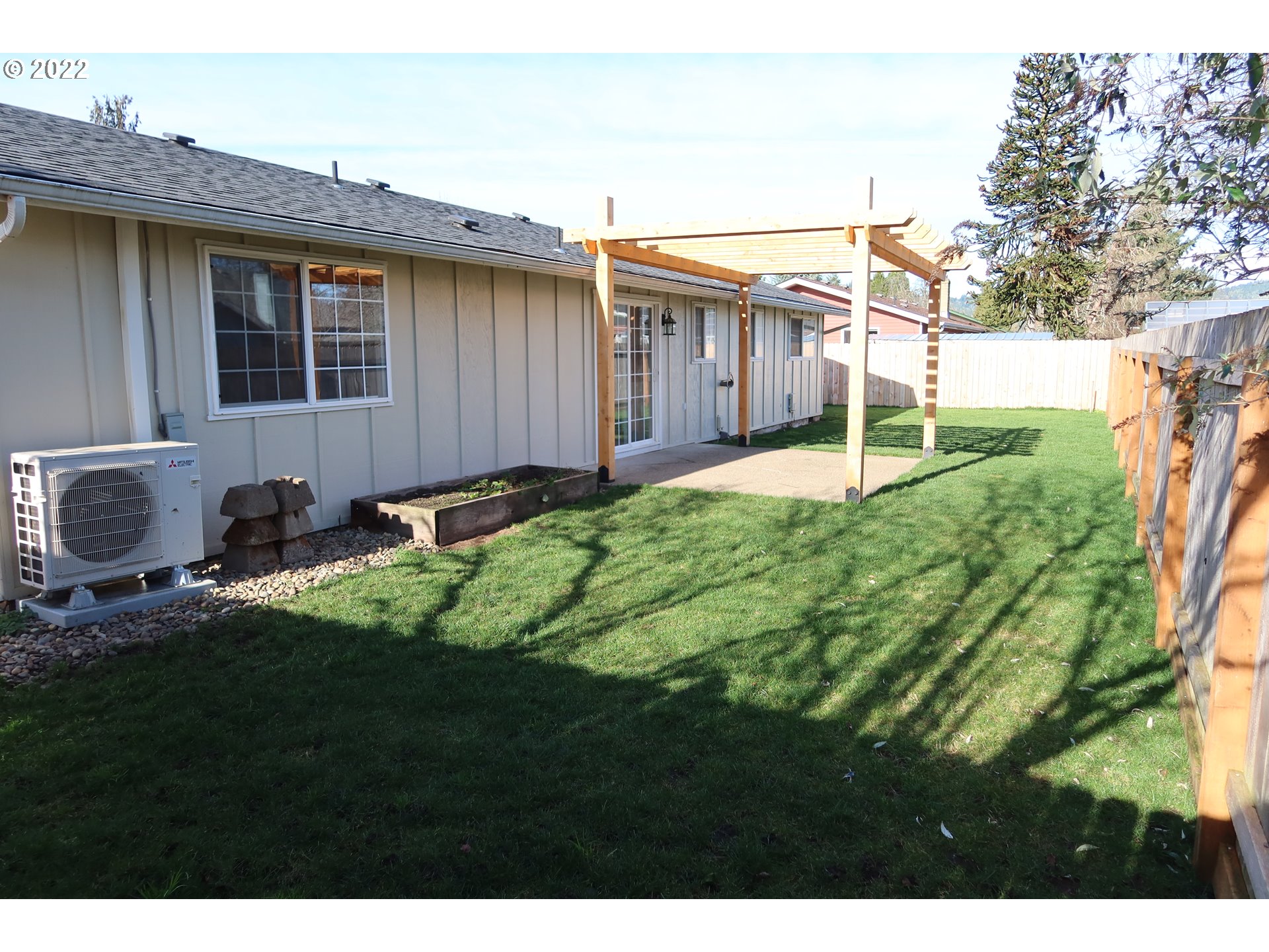 5330 B Street Springfield, OR 97478 - Photo 28 of 28 a backyard of a house with lots of green space