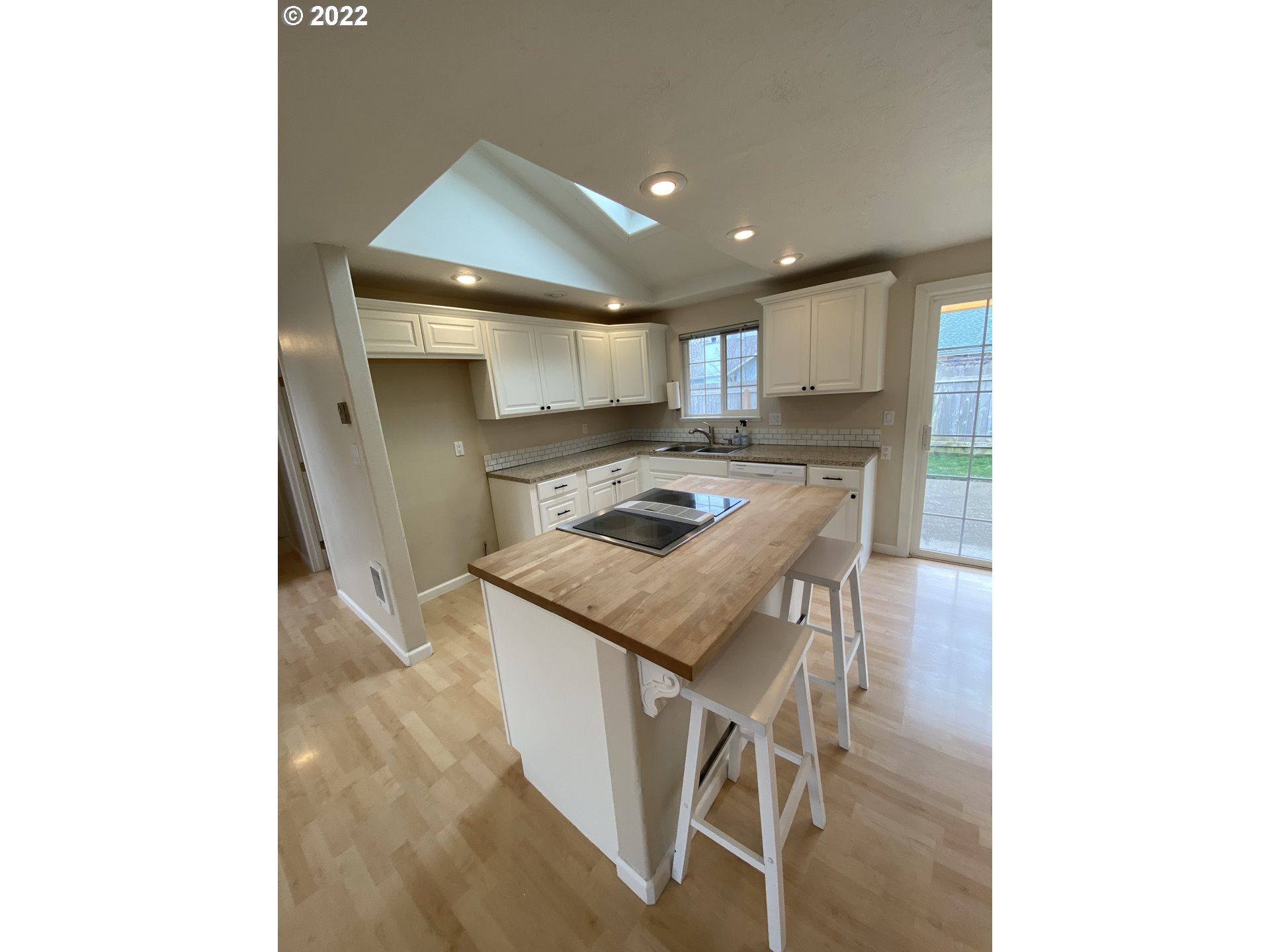 5330 B Street Springfield, OR 97478 - Photo 9 of 28 a kitchen that has a microwave a stove white cabinetry