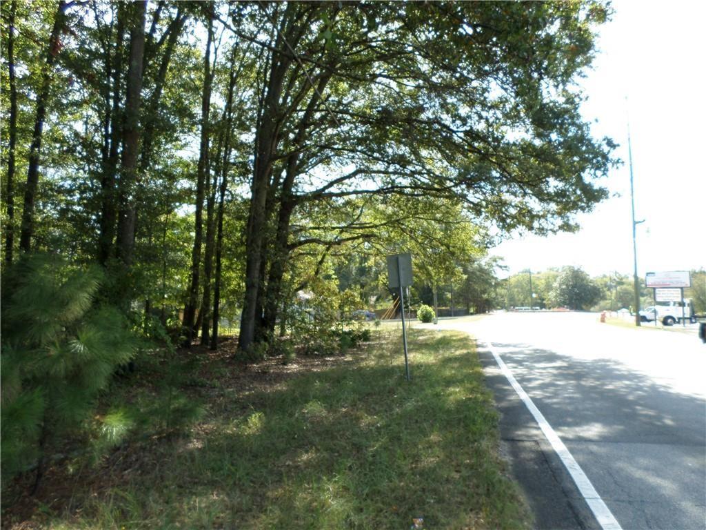 4595 Austell Powder Springs Road Southwest Austell, GA 30106 - Photo 9 of 16 a backyard of a house with lots of green space