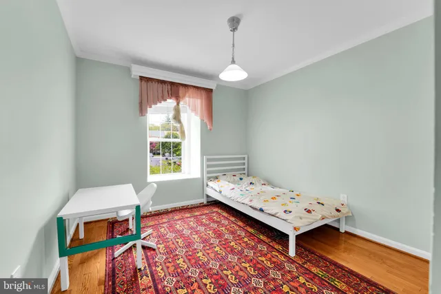 a bedroom with bed and window