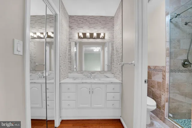 a bathroom with a shower and a sink