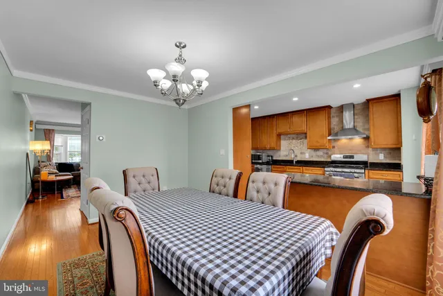 a bedroom with furniture and a large window