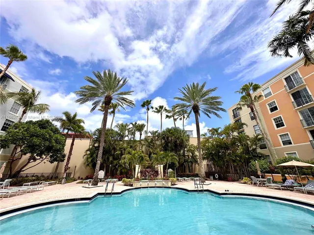 a view of swimming pool with outdoor seating