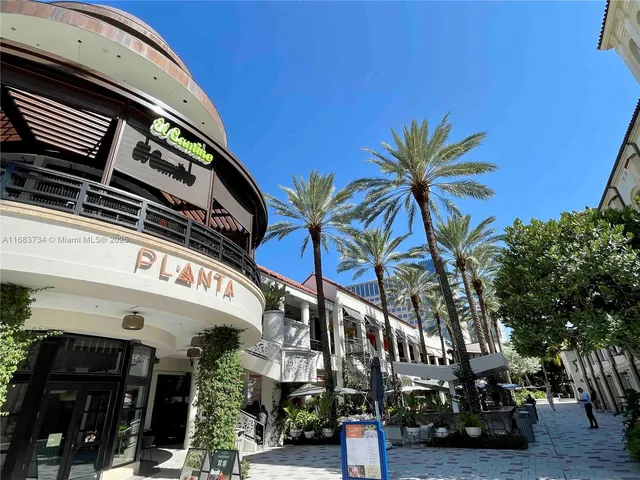 a view of a street with cars