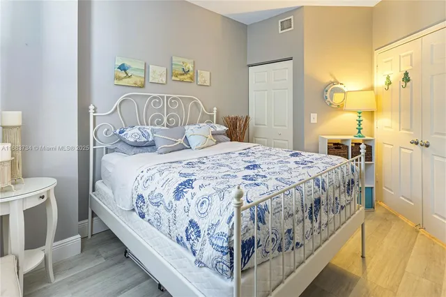 a bedroom with a bed and a table in it