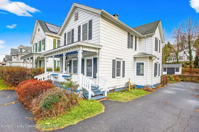 a front view of a house with yard