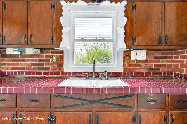 a kitchen with sink and window