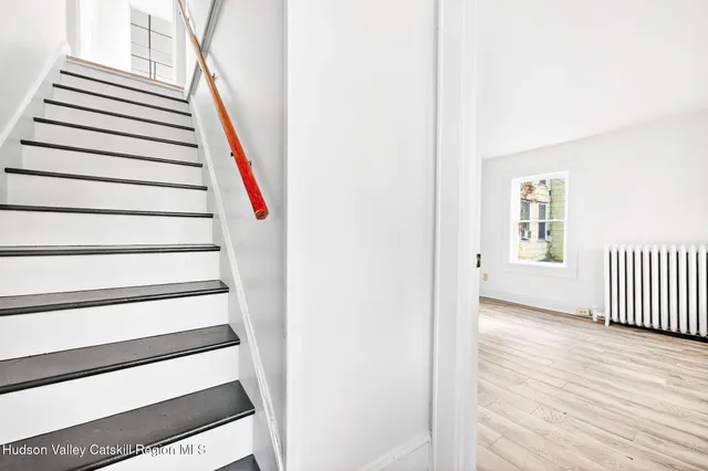 a view of a hallway with stairs