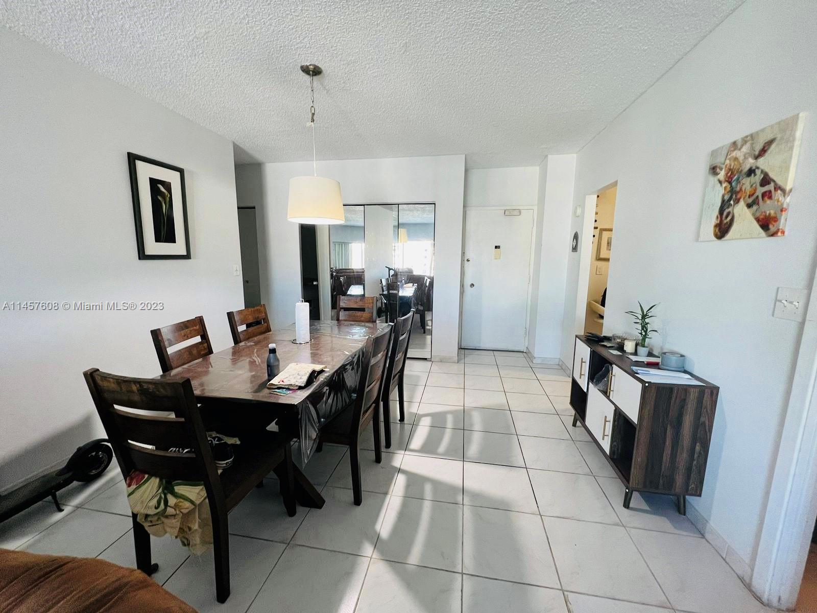 500 Bayview Drive, Unit 1417 Sunny Isles Beach, FL 33160 - Photo 7 of 13 a view of a dining room with furniture