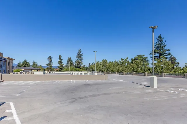 a view of a road with a building in the background