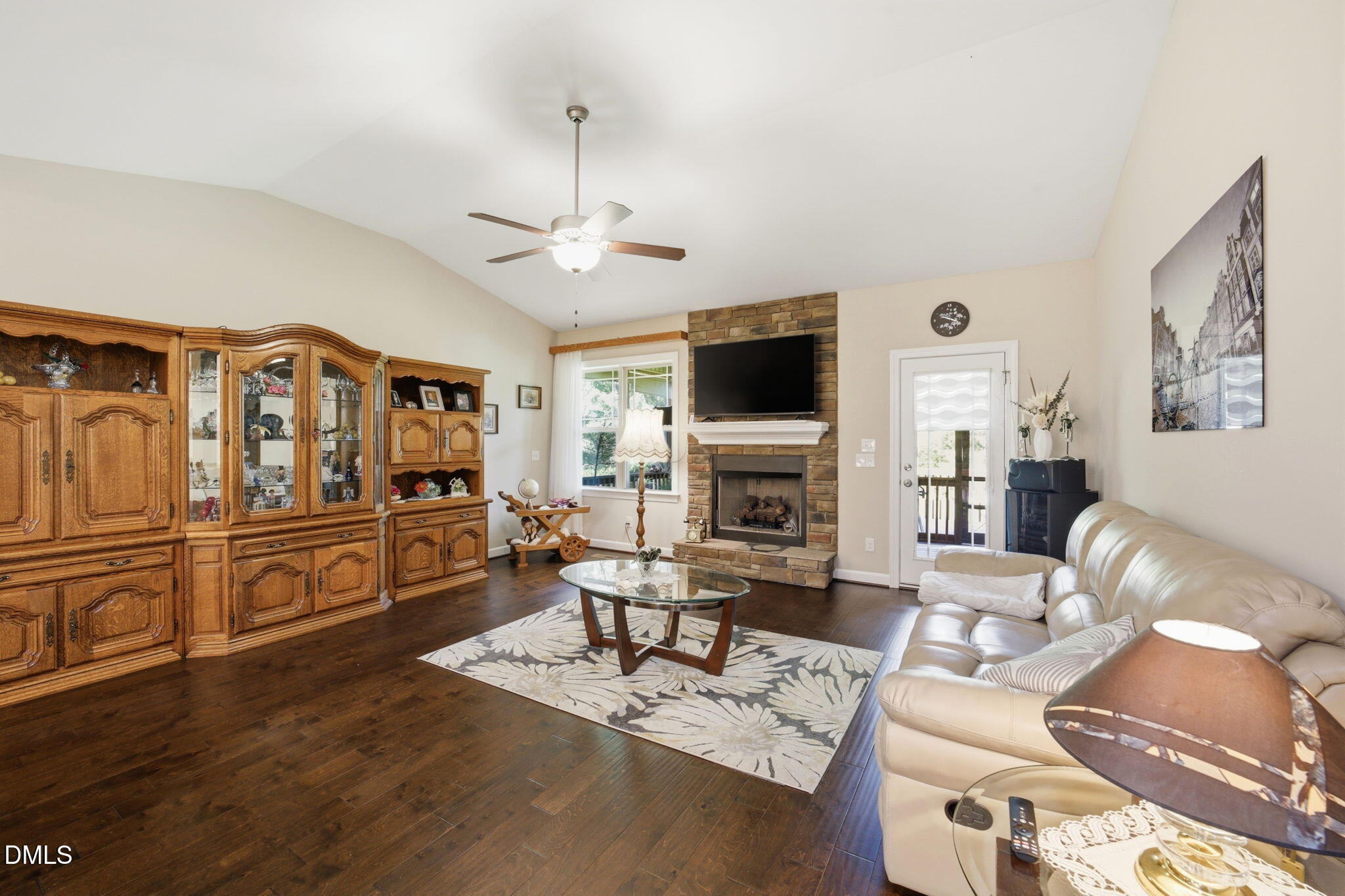 1547 Lassiter Pond Road Four Oaks, NC 27524 - Photo 11 of 45 a living room with furniture and a flat screen tv