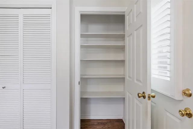 a bathroom with a granite countertop sink a mirror and a vanity