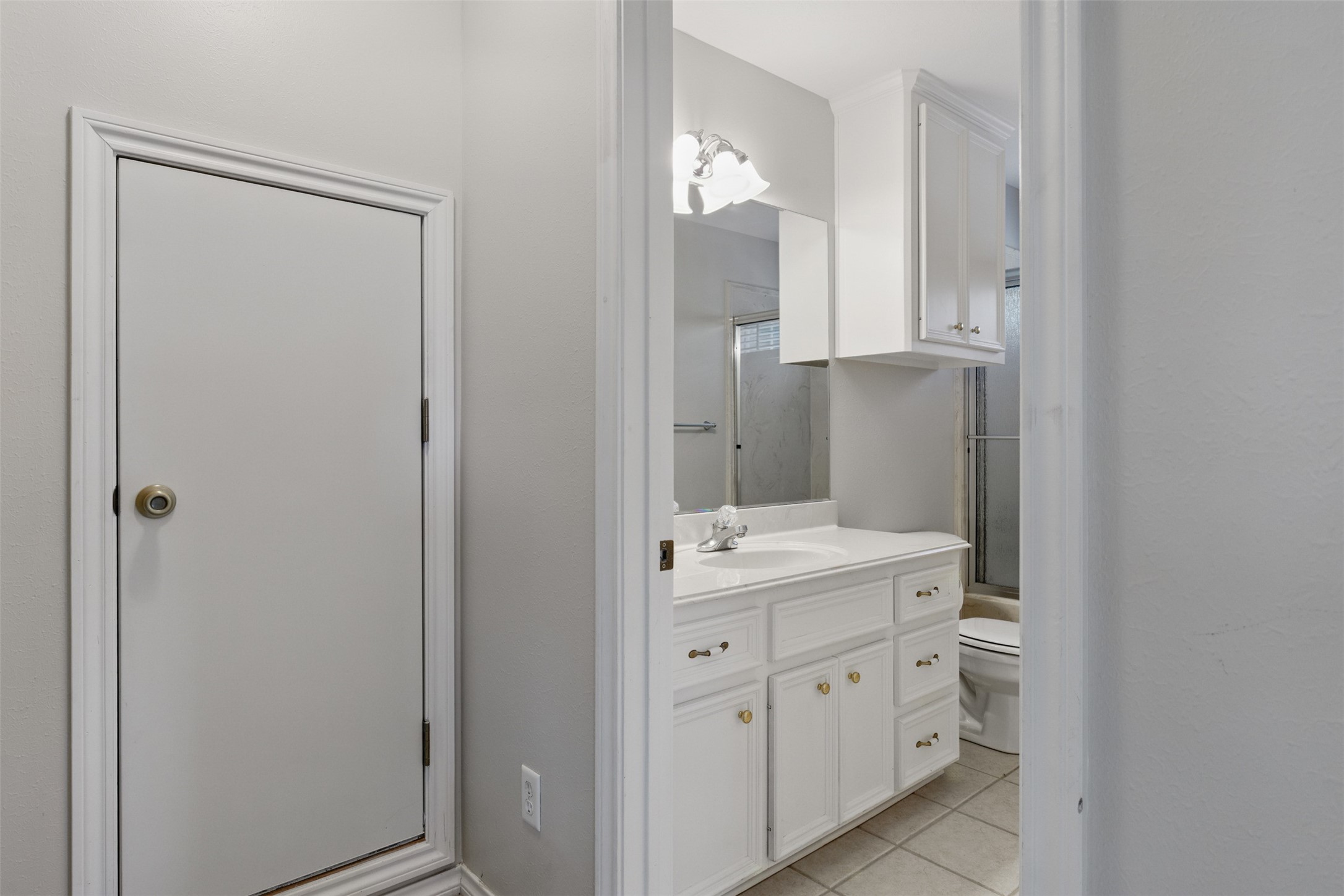 407 West Main Street Brenham, TX 77833 - Photo 26 of 50 a spacious bathroom with a double vanity sink and mirror