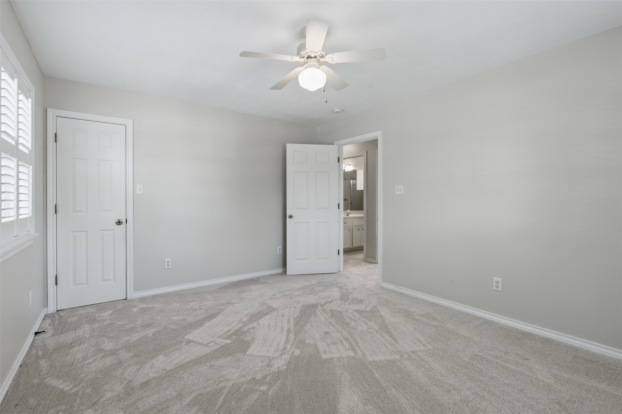 407 West Main Street Brenham, TX 77833 - Photo 32 of 50 an empty room with fan and windows