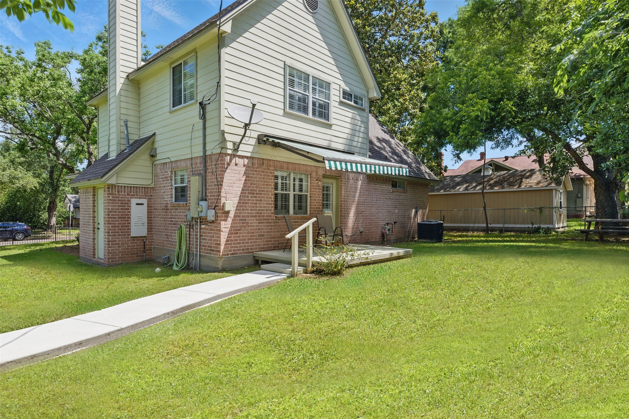 407 West Main Street Brenham, TX 77833 - Photo 35 of 50 a view of a house with backyard porch and sitting area