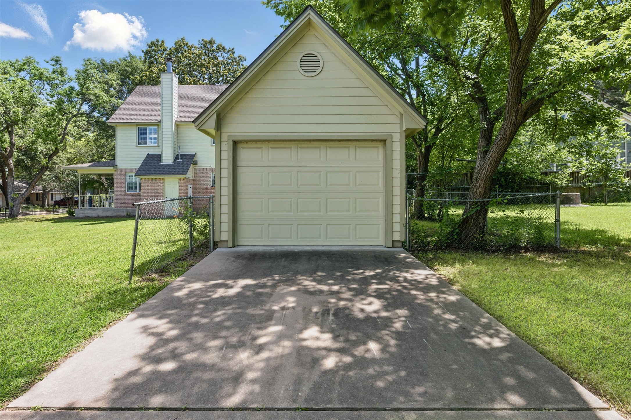 407 West Main Street Brenham, TX 77833 - Photo 37 of 50 a front view of a house with a yard and garage
