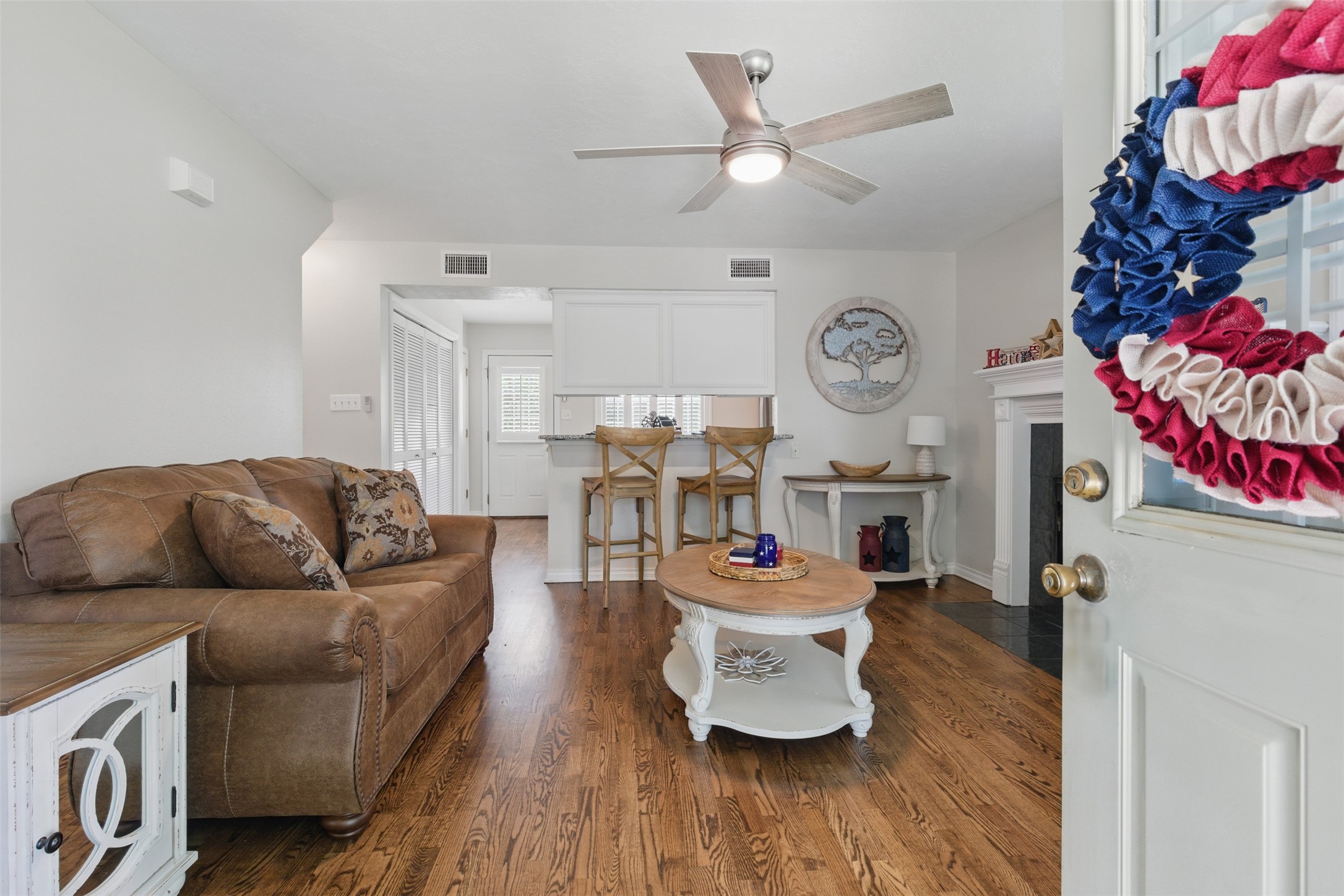 407 West Main Street Brenham, TX 77833 - Photo 7 of 50 a living room with furniture and a clock