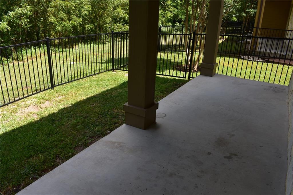 1310 West Parmer Lane, Unit 1503 Austin, TX 78727 - Photo 20 of 26 Fenced yard featuring a patio
