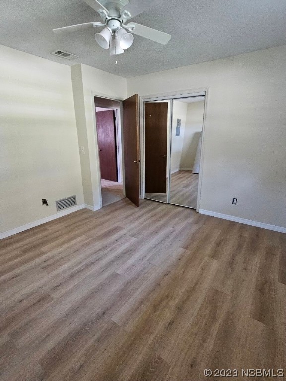 2410 Lime Tree Drive Edgewater, FL 32141 - Photo 6 of 18 a view of an empty room with wooden floor
