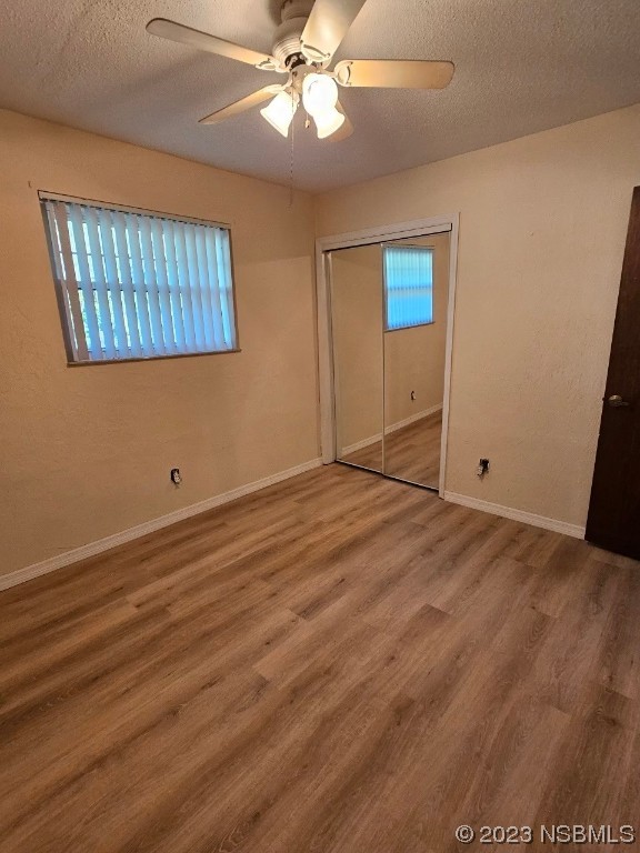 2410 Lime Tree Drive Edgewater, FL 32141 - Photo 7 of 18 wooden floor in an empty room with a window