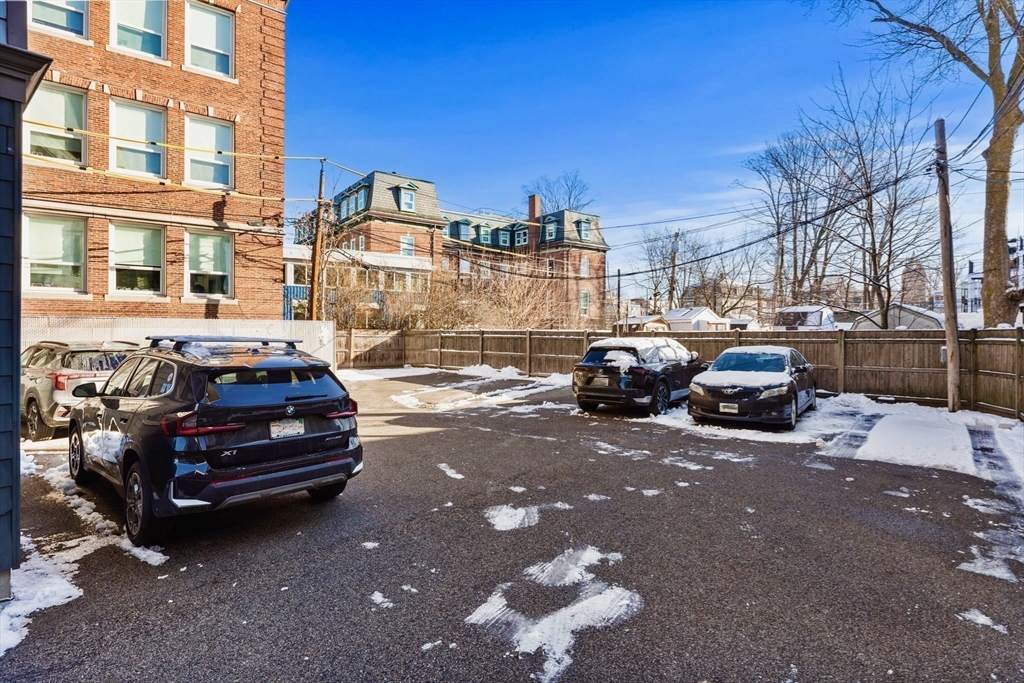 246 Boston Street, Unit 9 Boston, MA 02125 - Photo 20 of 24 a car parked in front of a house