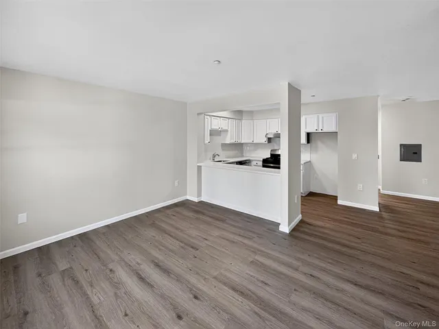 a view of a kitchen with wooden floor
