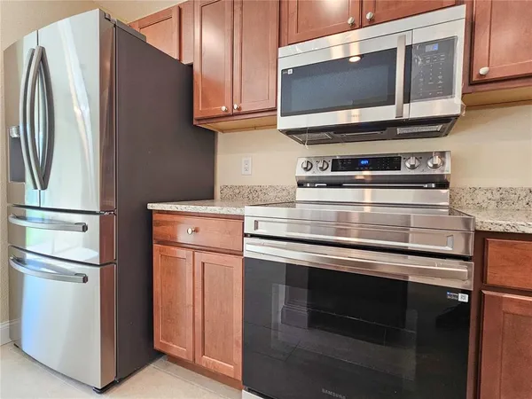 a kitchen with appliances and cabinets
