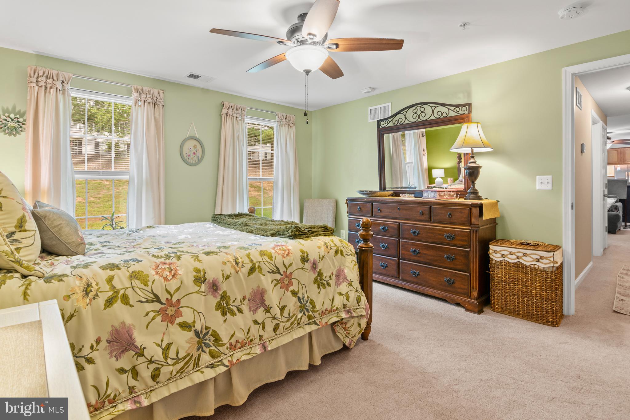 1402 Golden Rod Court, Unit 5 Belcamp, MD 21017 - Photo 14 of 28 a bedroom with a bed and dresser with mirror