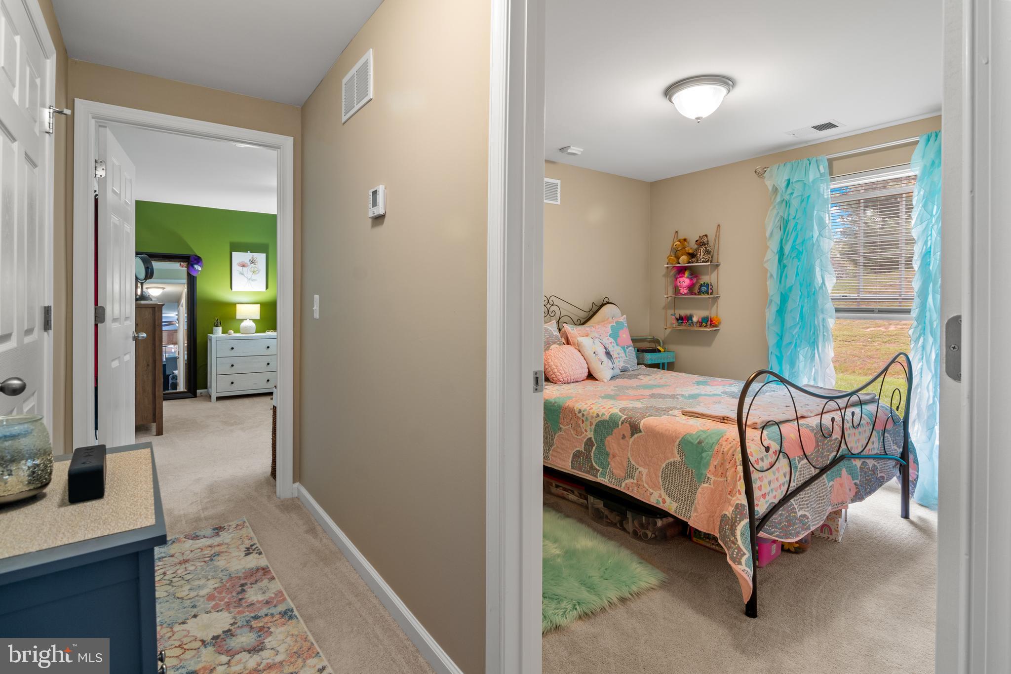 1402 Golden Rod Court, Unit 5 Belcamp, MD 21017 - Photo 16 of 28 a bedroom with a bed and wooden floor